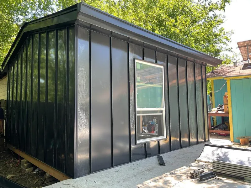 Black standing seam metal wall panels for Roof Inspection in Hamilton